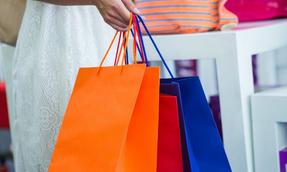 Pretty woman shopping for bags at the shopping mall